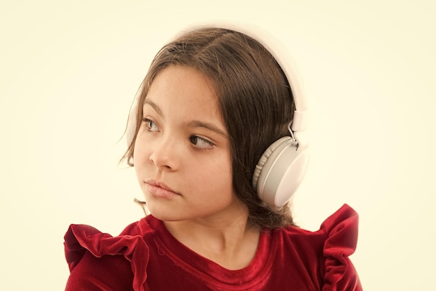 Music is so much fun small girl in red dress childhood and happiness small child in headphones music listening ebook audio education kid fashion and beauty happy childrens day