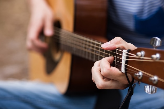 music lifestyle. man playing guitar. artist instruments.