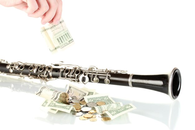 Musical instrument with money isolated on white