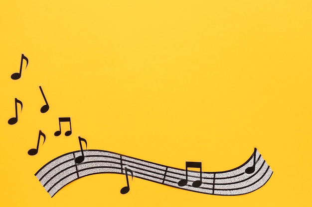 Musical stave and notes on yellow background