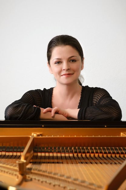 Musician by the great piano