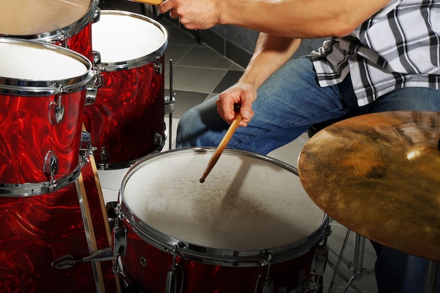 Musician playing the drums closeup