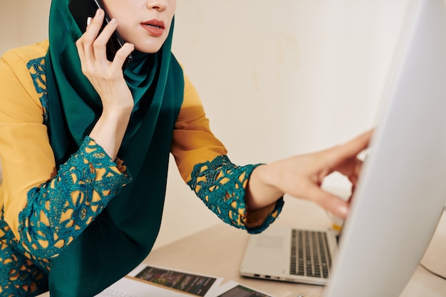 Muslim business lady talking on phone