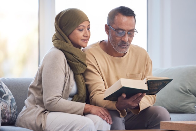 Muslim couple reading Quran and spiritual with islam hijab and book for faith trust and learning scripture in home Islamic man woman and read religious book support and learn on eid Mubarak