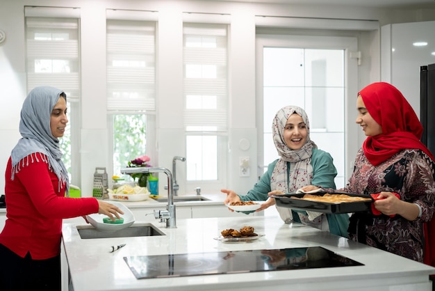 Muslim family and friends gathering together at home for eating dinner high quality photo