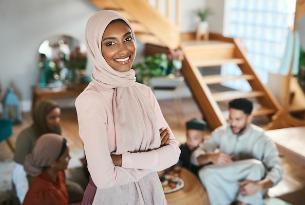 Muslim islam woman on EID with family at house in Pakistan Saudi Arabia or Iran to celebrate ramadan Young girl smile in hijab with food in solidarity on islamic holiday together in family home