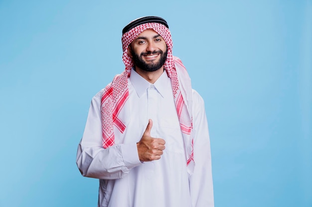 Muslim man showing thumb up portrait