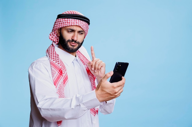 Muslim man speaking in videoconference