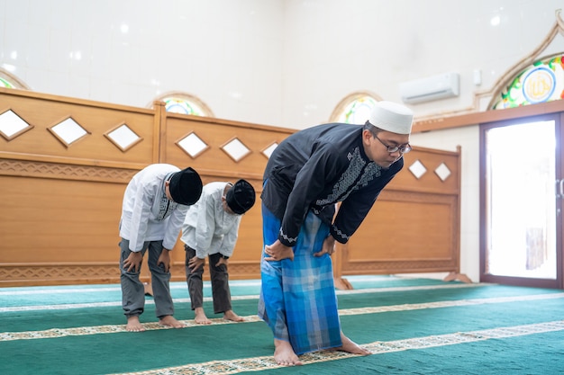 Muslim people praying in the mosque