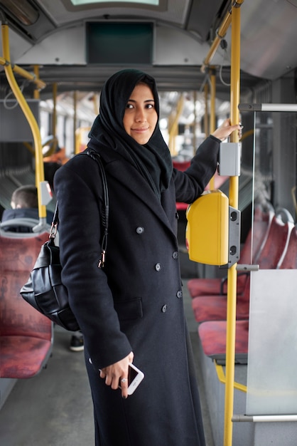 Muslim person travelling through the city