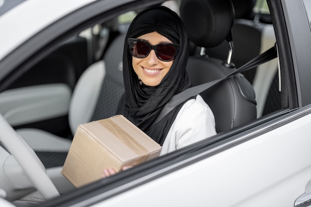 Muslim woman drives a car