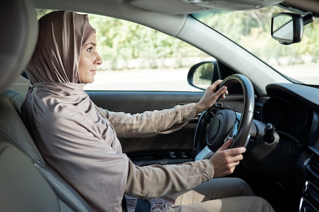 Muslim woman driving car