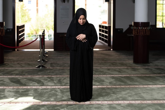 Muslim Woman Praying at the Mosque