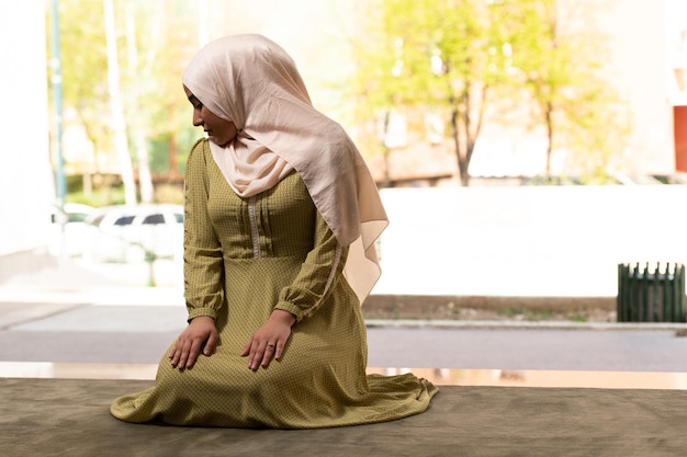 Muslim Woman Praying at the Mosque