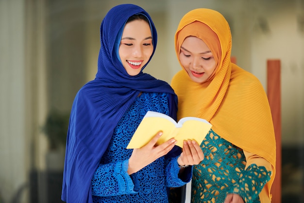 Muslim women reading holy book