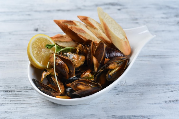 Mussels with croutons, mussel dish, grilled seafood, top view