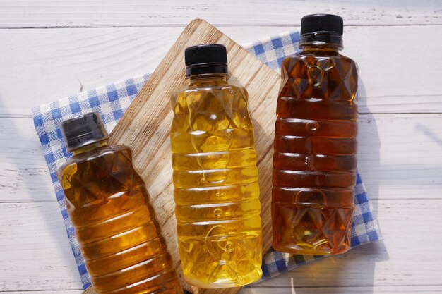 Mustard oil in a plastic jar on table