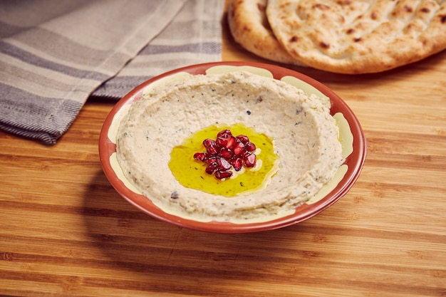 Mutable with Bread served in dish isolated on table side view of middle east food