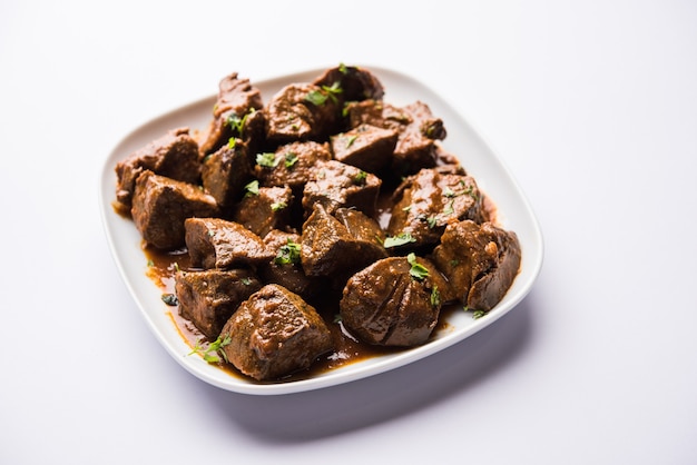 Mutton Liver fry or Kaleji masala, popular Non vegetarian recipe from India and Pakistan. served dry or with curry in a bowl, karahi or plate