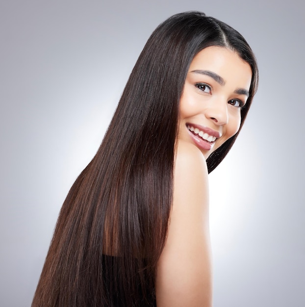 My hair was in need of a major upgrade in colour Studio portrait of an attractive young woman posing against a grey background