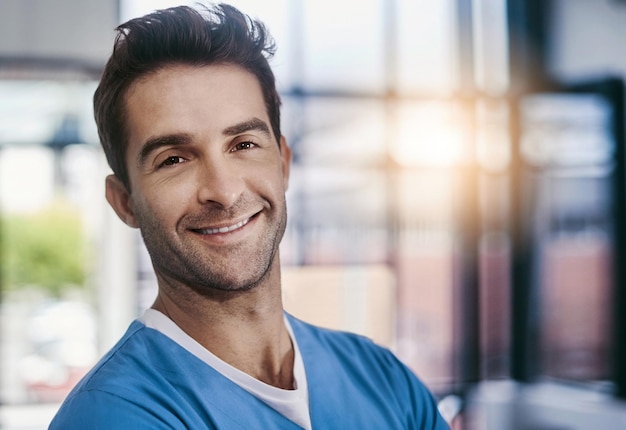 My job is to improve your health Portrait of a young handsome male medical practitioner working in a hospital