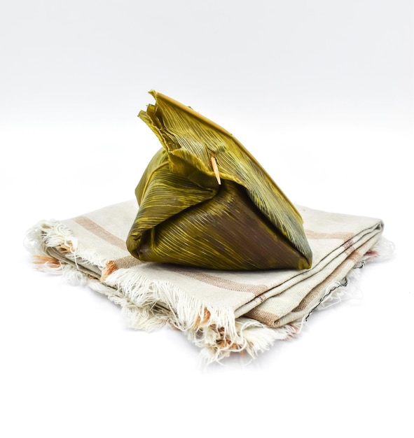 Myanmar or Burmese traditional street food zongzi called mont phet htok made of rice sugar and coconut Isolated on white background