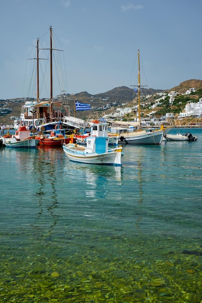 Mykonos port with fishing boats and yachts and vessels Greece