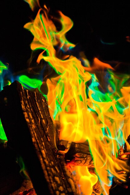 Mystical Dance of Campfire Flames in Vivid Orange and Green