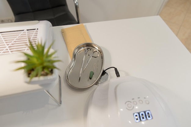 Nail salon workplace of a manicurist manicure tools closeup