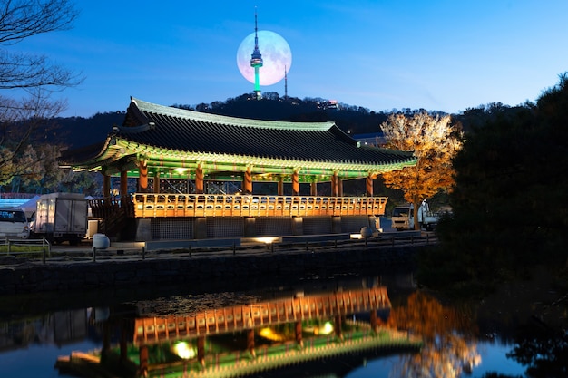 Namsangol Hanok Village in Autumn with full moon Seoul South Korea