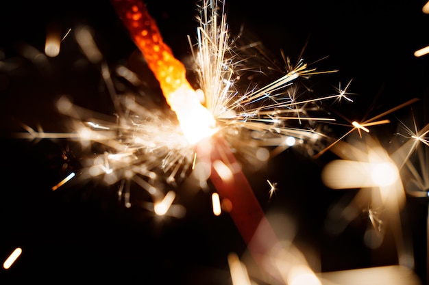 Narrow depth of field Lightening sparkler on the black background