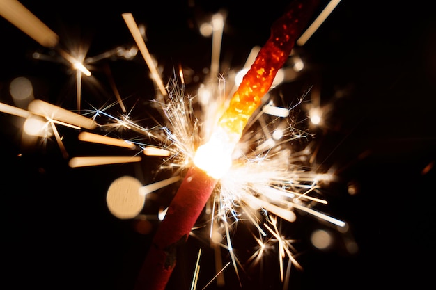 Narrow depth of field Lightening sparkler on the black background