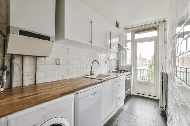 Narrow long kitchen with wood worktop