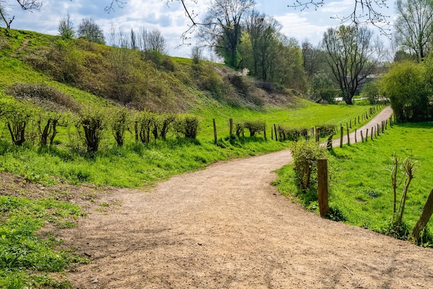 Narrow path in the countryside surrounded by green valley