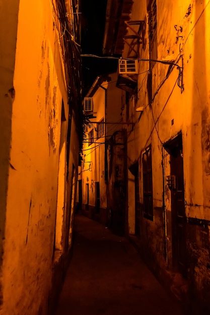 Narrow street at night in a Stone town Zanzibar Tanzania