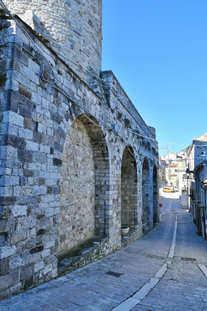 A narrow street among the old houses of Civitacampomarano a town in the state of Molise in Italy