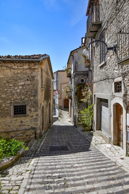 A narrow street between the old houses of Morcone a village in Campania Italy