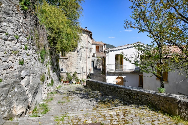 A narrow street between the old houses of Morcone a village in Campania Italy