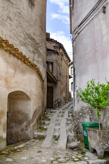 A narrow street between the old houses of Petina a village in Campania Italy