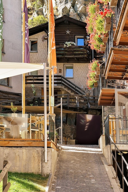 Narrow street in Zermatt resort village in Switzerland in summer