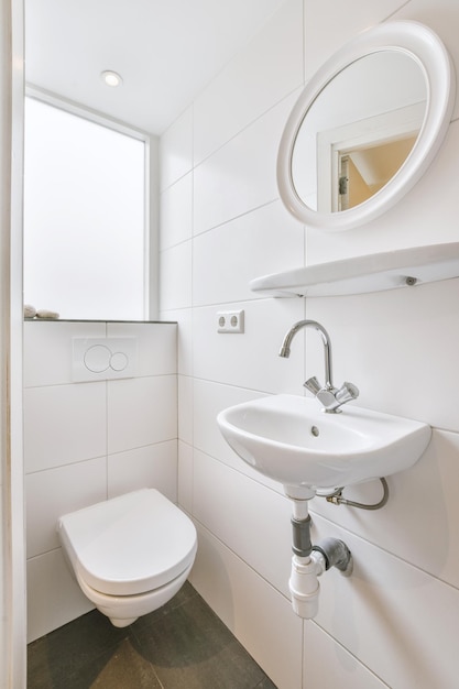 Narrow toilet room with minimalist design