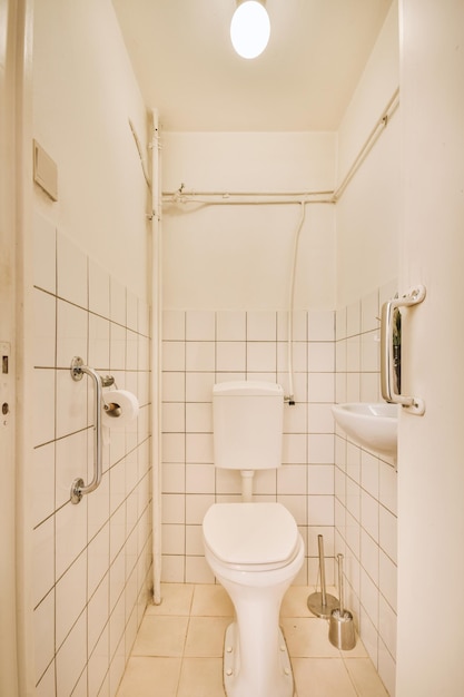 Narrow toilet room with minimalist design