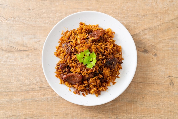 Nasi goreng fried rice with pork in Indonesia style