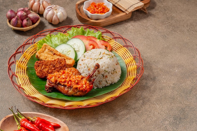 Nasi Jeruk Ayam Geprek is Indonesian Food crispy fried chicken with hot and spicy sambal bawang