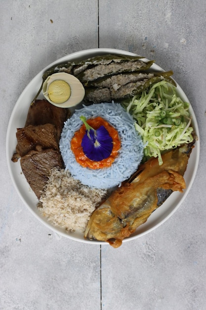 Nasi kerabu kelantan traditional Malay rice dish consist of meat fish salt egg and vegetables