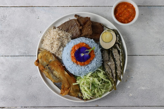 Nasi kerabu kelantan traditional Malay rice dish consist of meat fish salt egg and vegetables