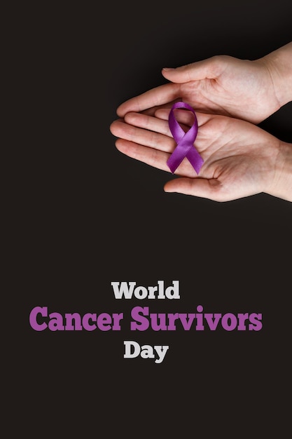 National Cancer Survivors Day Adult hands holding purple ribbon on black background