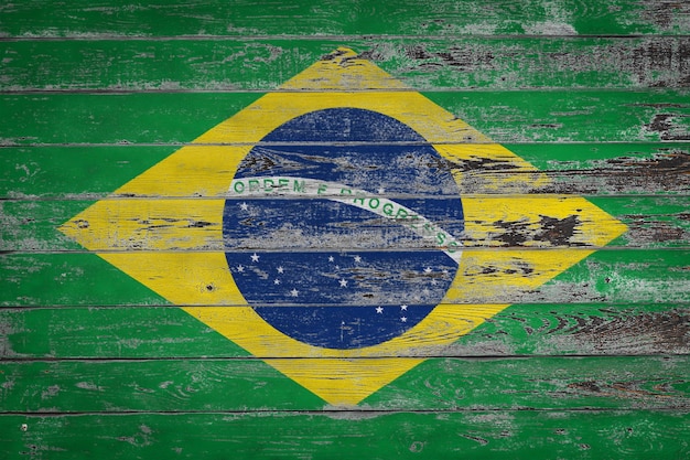 The national flag of Brazil is painted on uneven wooden boards Country symbol