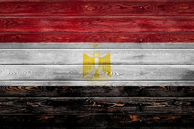 The national flag of Egypt is painted on a camp of even boards nailed with a nail The symbol of the country