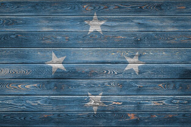 The national flag of Federal States of Micronesia 
 is painted on a camp of even boards nailed with a nail. The symbol of the country.